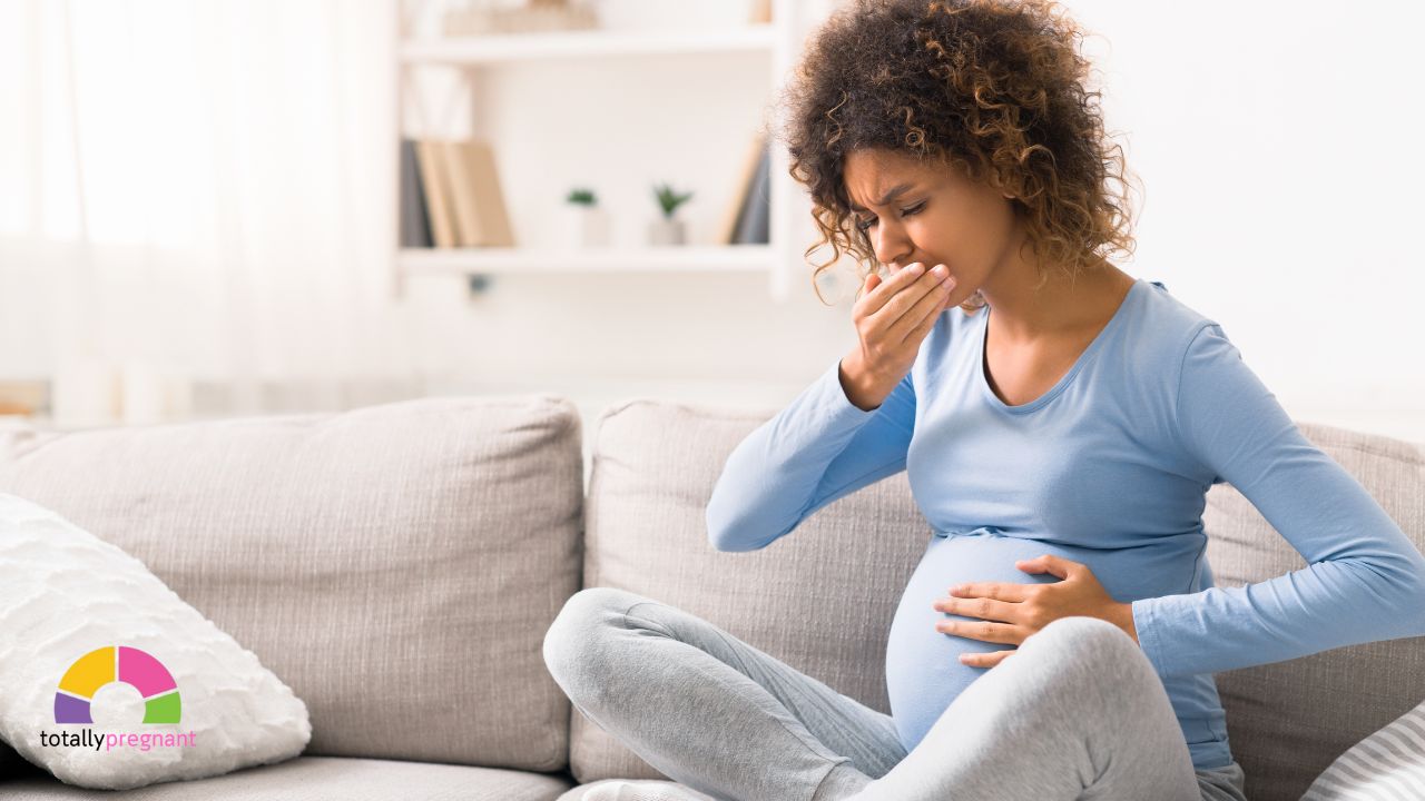 a pregnant woman holding her stomach